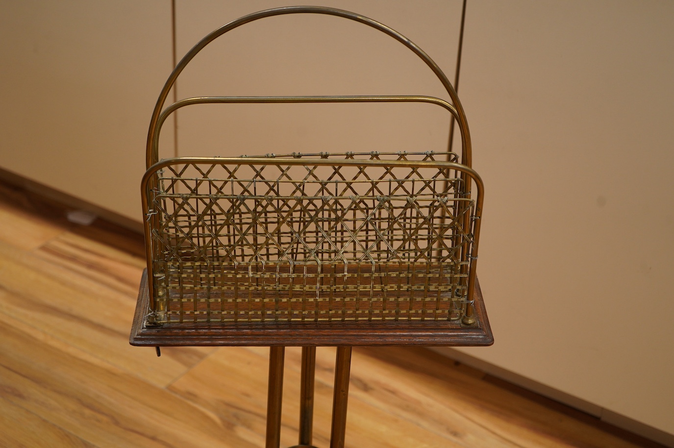 An Edwardian oak and brass Canterbury stand, 76cm. Condition - fair to good.